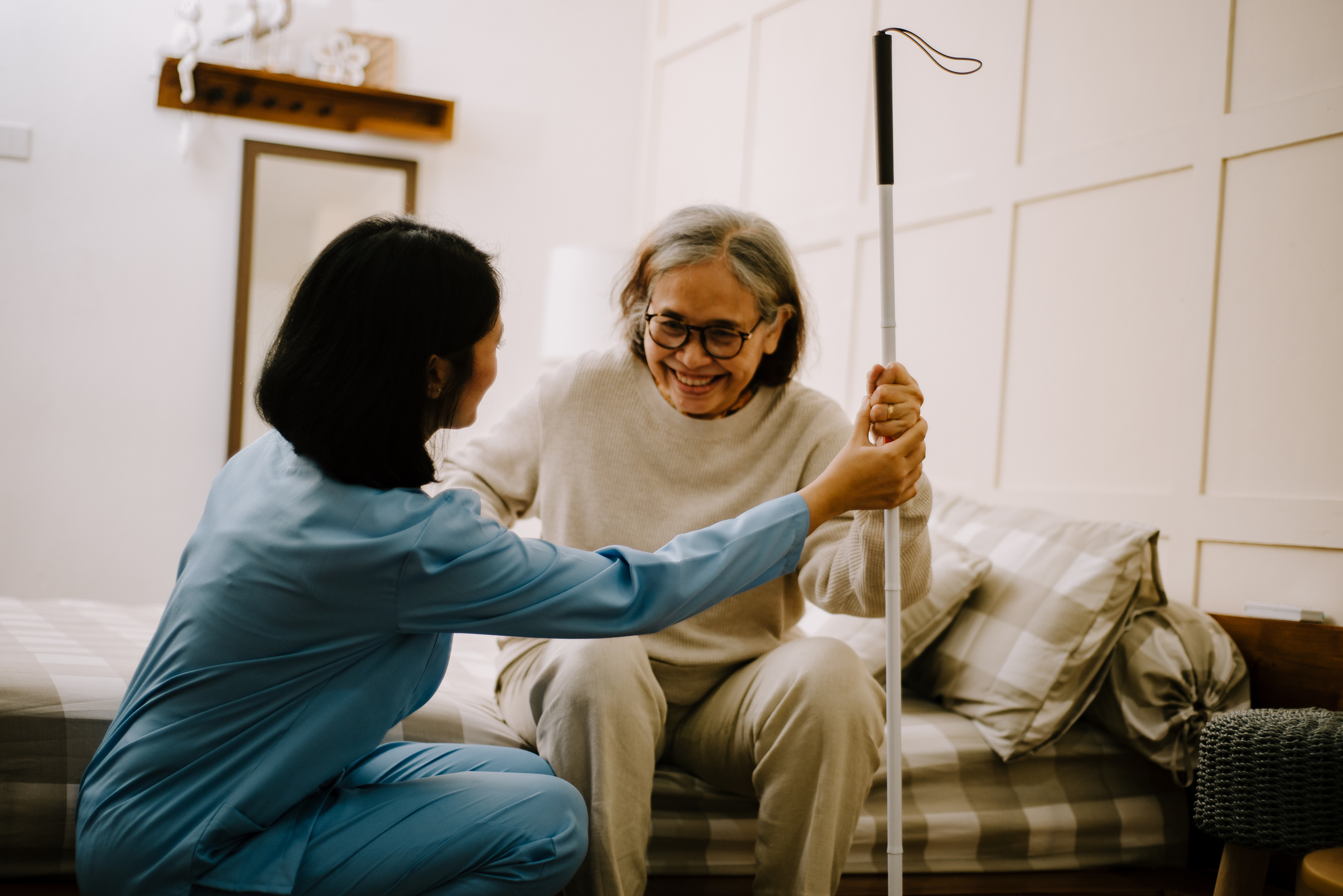 Nurse Taking Care of an Elderly Woman